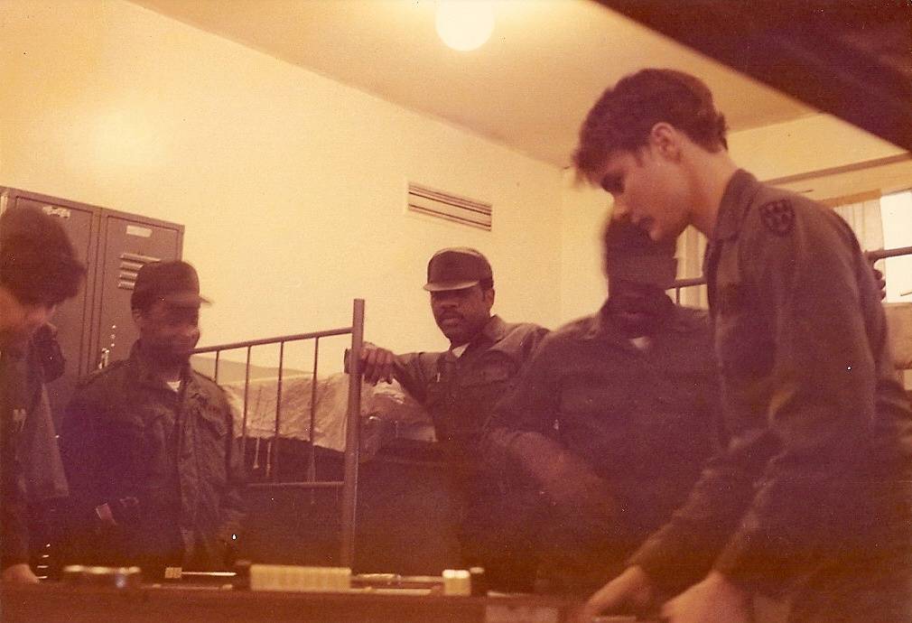 Mark bozeman and others letting off steam playing foosball off duty but on 24 hour duty